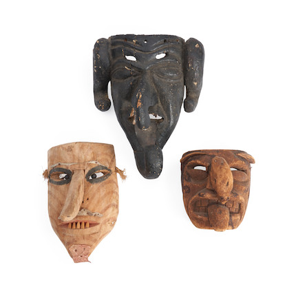 Bonhams Skinner : Three Mexican wood face masks lg. 13, 10 1/2, and 7 in.