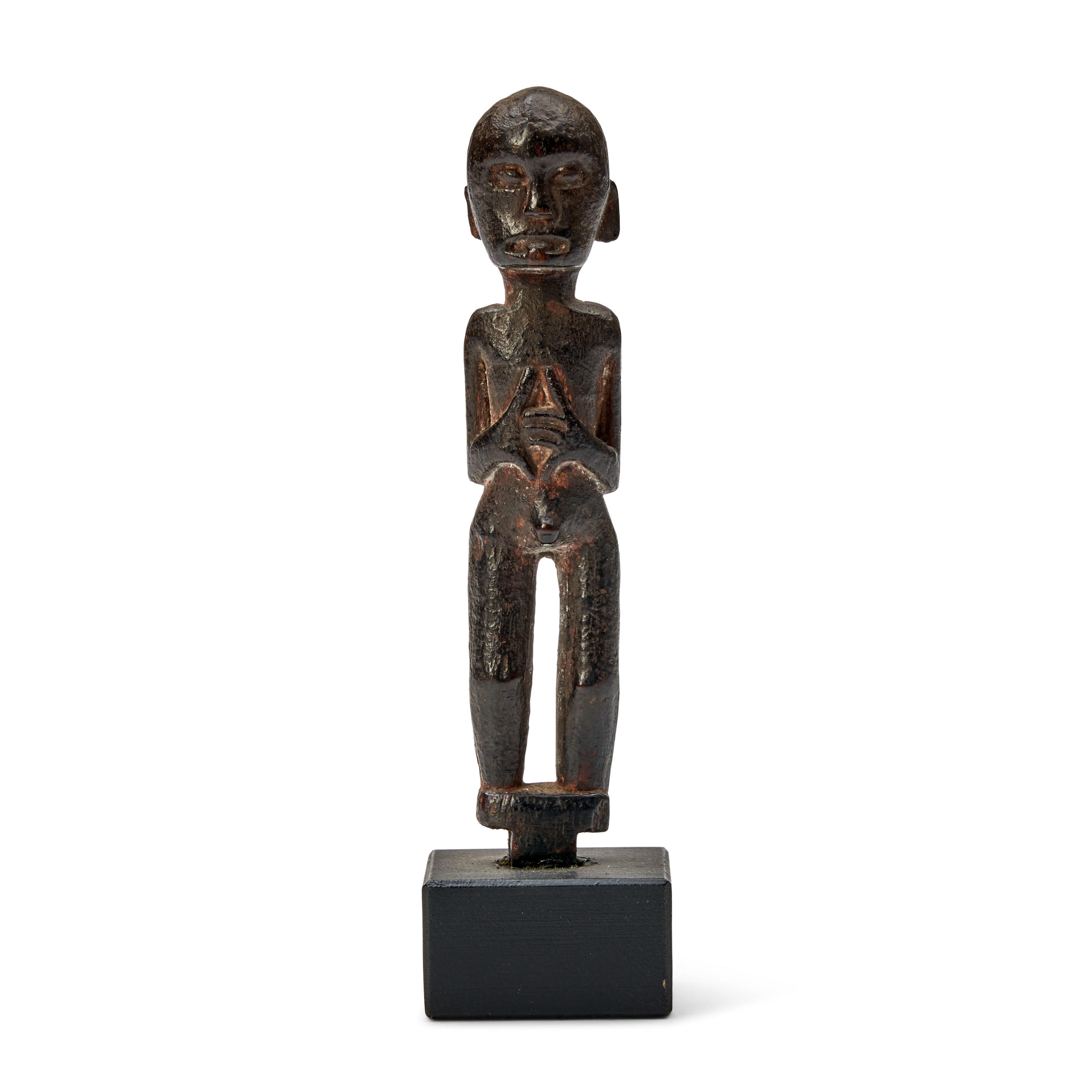 Bonhams Skinner : A Dayak amulet figure ht. 4 1/8 in.