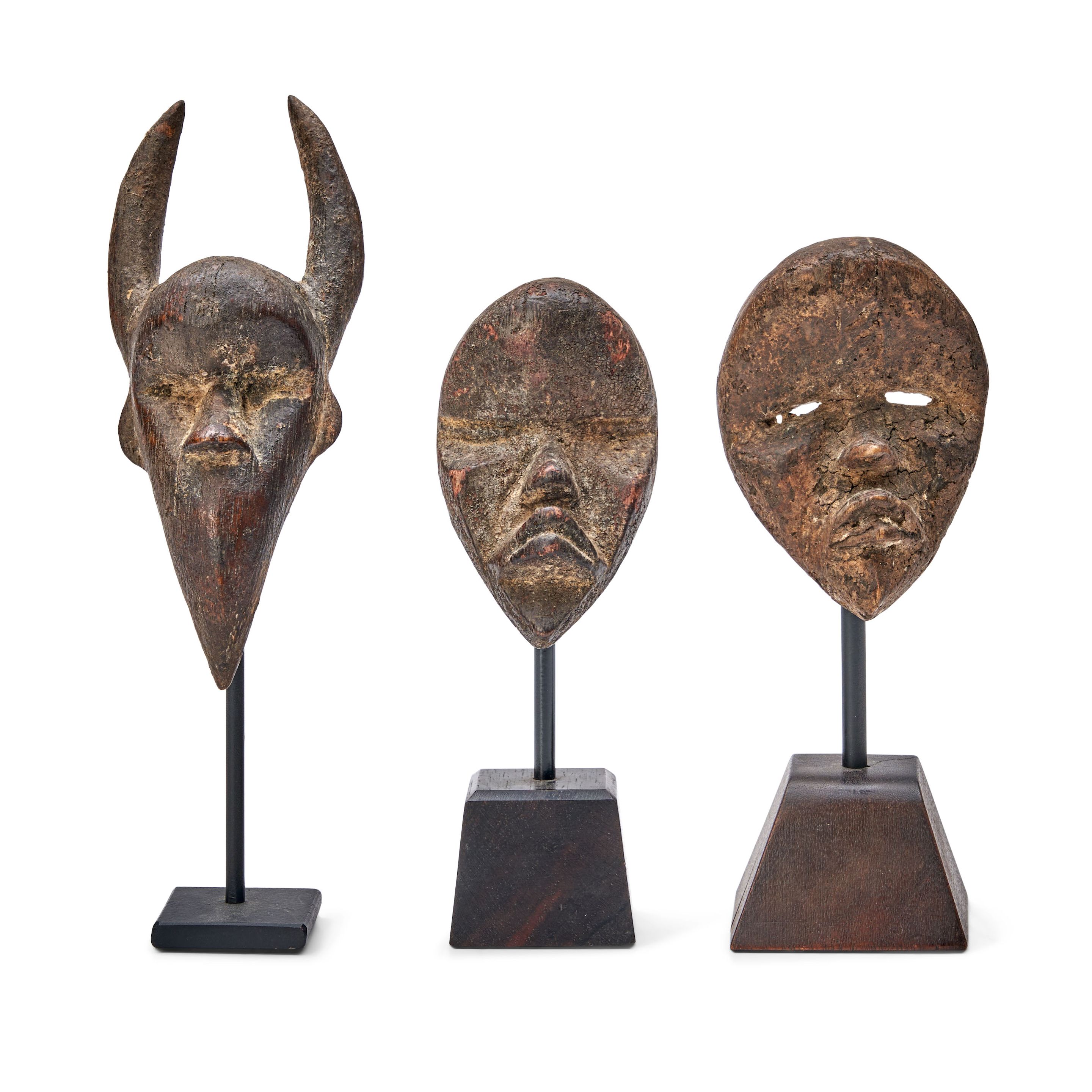 Bonhams Skinner : Three Dan passport masks ht. 6 1/2, 3 3/4, and 3