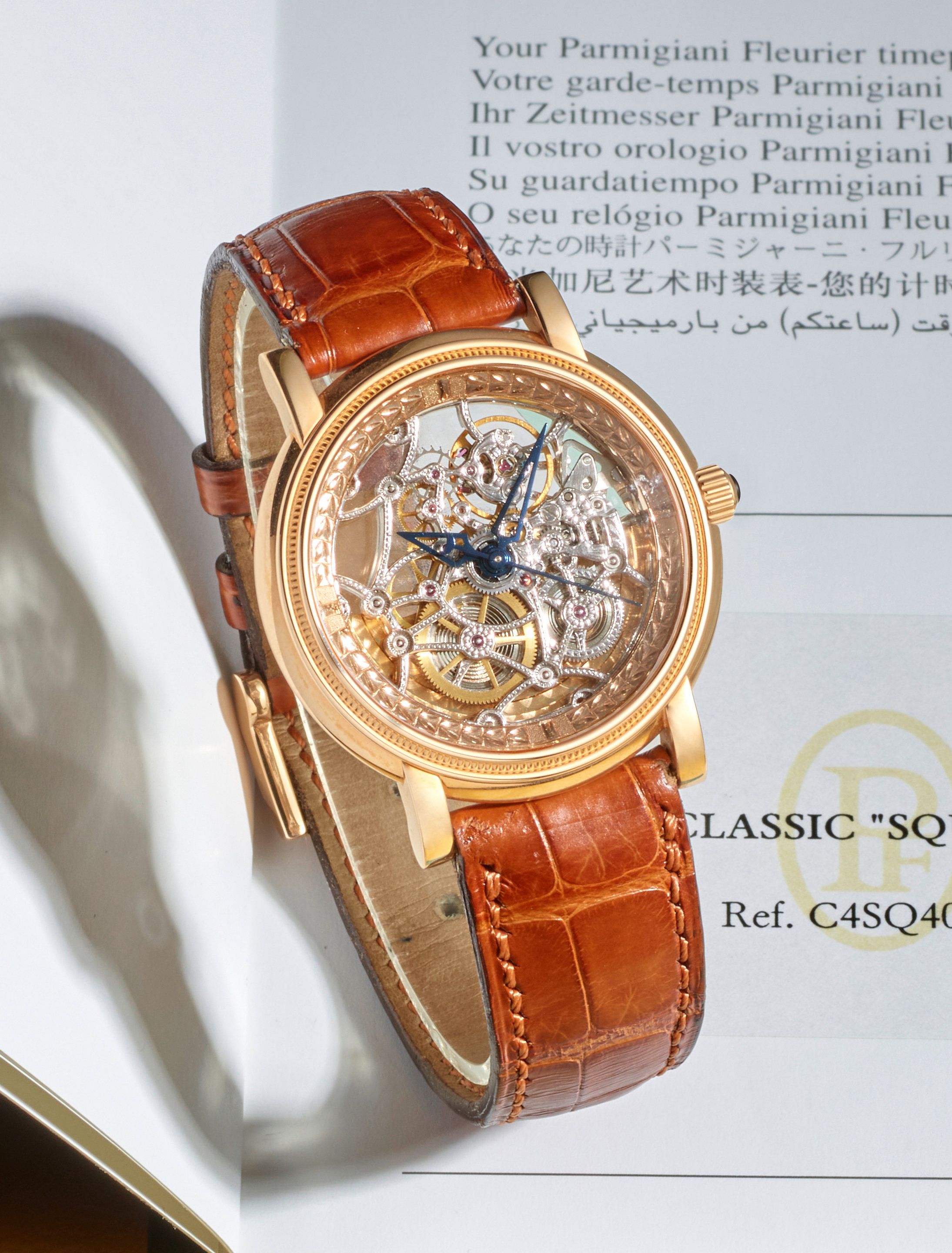 Bonhams PARMIGIANI AN 18K ROSE GOLD AUTOMATIC